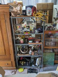 lot 91 image: Shelf And Contents, 1.5 Amp Battery Maintainer, Cordomatic Clothesline, Upholstery Shampooer, Bale Bearing Motor And More