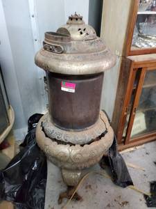 lot 163 image: Round Oak Cast Iron Antique Wood Stove