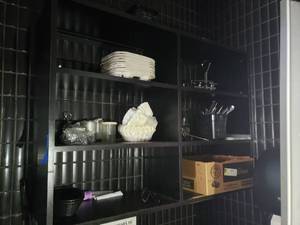 lot 4892 image: Hanging shelf with contents