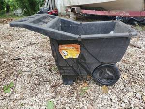 lot 6495 image: Hard Black Plastic Handy Hauler Wheel Barrow