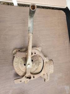 lot 6564 image: Cast Iron Black Hawk Trade Mark Corn Husker