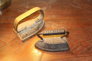 lot 1078 image: (2) Antique Sad Irons, P&N MFG. Co. and unmarked