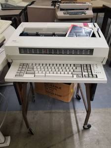 lot 241 image: (2) IBM Wheelwriter 1500 And Table