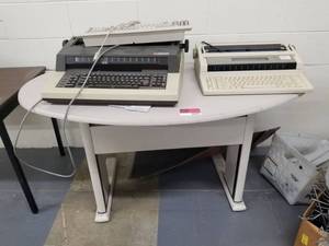lot 242 image: (2) Type Writers And Table