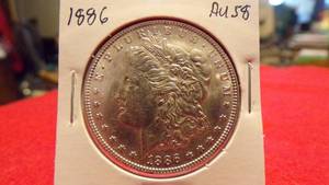 lot 6888 image: 1886 MORGAN SILVER DOLLAR - AU58