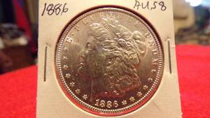 lot 6889 image: 1886 MORGAN SILVER DOLLAR - AU58