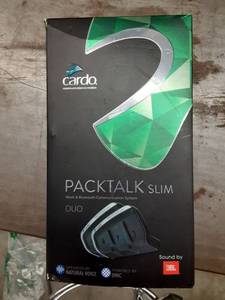 lot 1104 image: Cardo DMCBluetooth PACKTALK SLIM Motorcycle Communication and Entertainment System With Natural Voice Operation, Sound By JBL, Connect 2 to 15 Riders (Dual Pack) Black, 2 Pack