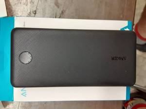 lot 1153 image: Anker Portable Charger, PowerCore Essential 20000mAh Power Bank with PowerIQ Technology and USB-C (Input Only), High-Capacity External Battery Pack Compatible with iPhone, Samsung, iPad, and More.