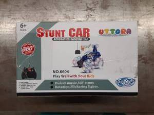 lot 1204 image: UTTORA Remote Control Car, Invincible Tornado Twister Remote Control Truck,360 Degree Spinning Flips Color Flash & Music Kids