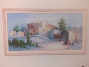lot 1017 image: Large Desert Scene Painting Powder Pink Wooden Frame Painting With Adobe Huts