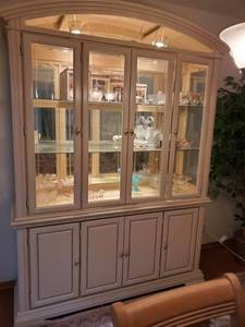 lot 2021 image: SARATOGA 2 Piece Off White Display Cabinet with Lights and Glass Shelves with Lower Storage. CONTENTS NOT INCLUDED