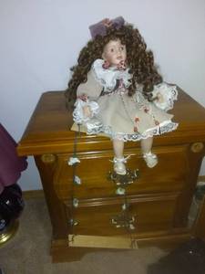 lot 8256 image: Ceramic Doll For Hanging With Wooden Swing