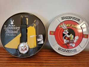 lot 5946 image: ACME Loony Tunes. Collectible Watch in Movie Reel Tin
