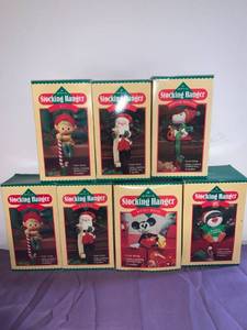 lot 8704 image: Lot of 7 Hallmark Stocking Hangers Basement Shelf 1