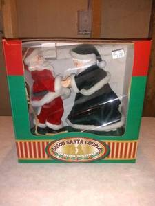 lot 8731 image: Dancing Disco Santa Couple