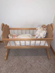 lot 8833 image: Wooden Baby Crib With 2 Vintage Baby Dolls Location Under Pool Table