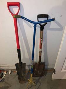lot 8954 image: Two Shovels and a Garden Claw Location Garage