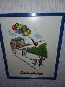 lot 1250 image: Curious George Framed Art in Blue Frame 21 x 17 in