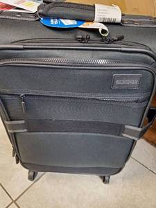 lot 2563 image: American Tourister Luggage Comfort in the palm of yours Hands All Belt And Suspenders over the top Style And Performance To Help Compress or Expand To Fit your Packing