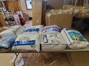 lot 11722 image: Box full of pillows and mattress pads