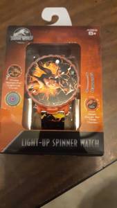 lot 1116 image: Nwt- Kids Jurassic Park Digital Light Up Spinner Lcd Watch-adj. Band