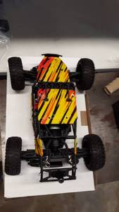 lot 1977 image: HAIBOXING 12815 RC Car 112 Scale 4WD Off-Road Remote Control Car Front shock is broken.
