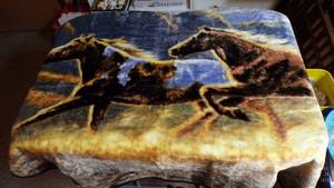 lot 7008 image: PLUSH LAP BLANKET - HORSES