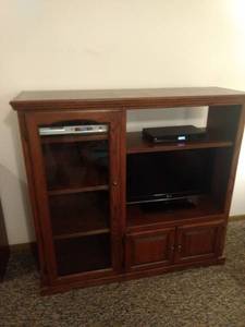 lot 8242 image: entertainment center 34 in wide 18in deep 50 inches tall contents not included