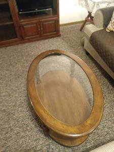 lot 8243 image: wood and glass coffee table and end table coffee table is 42 in Long 26in across 16 in tall end table is 26 in by 22 in 20 in tall
