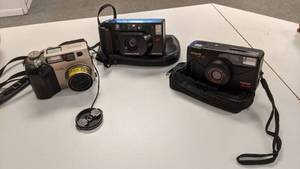 lot 9224 image: three cameras one Argus one Minolta freedom dual and one olympus