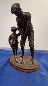 lot 9337 image: father teaching son to play golf statue