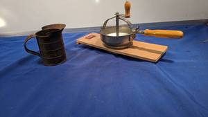 lot 9388 image: vintage measuring cup and cherry pitter