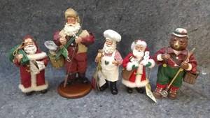 lot 7224 image: Four Santa Figures and a Fly Fishing Bear