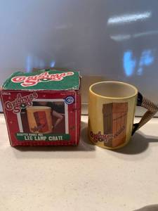 lot 6873 image: A Christmas Story Sculpted Handle Mug Leg Lamp Crate Location Shelf D
