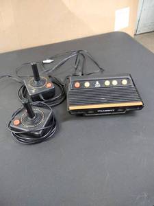 lot 1656 image: atari game system with cords