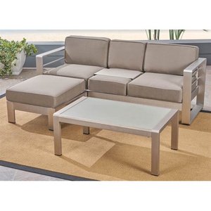 lot 2739 image: Cape Coral Outdoor 3-Seater Aluminum Sofa Set with Coffee Table and Ottman by Christopher Knight Home Retail $897.99