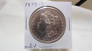 lot 7144 image: 1879 S MORGAN SILVER DOLLAR - MS64