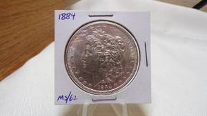 lot 7155 image: 1884  MORGAN SILVER DOLLAR - MS62