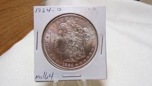 lot 7157 image: 1884-O  MORGAN SILVER DOLLAR - MS64