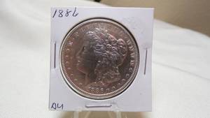 lot 7162 image: 1886  MORGAN SILVER DOLLAR - AU