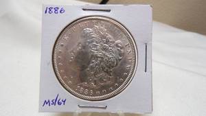 lot 7163 image: 1886  MORGAN SILVER DOLLAR - MS64