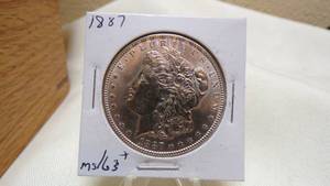 lot 7165 image: 1887  MORGAN SILVER DOLLAR - MS63
