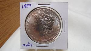 lot 7167 image: 1889  MORGAN SILVER DOLLAR - MS64