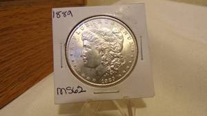lot 7168 image: 1889  MORGAN SILVER DOLLAR - MS62