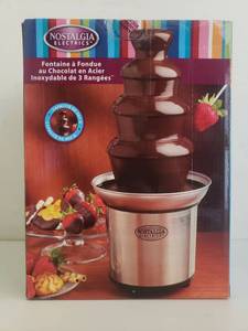 lot 76287 image: Nostalgia CFF986 4-Tier Stainless Steel Chocolate Fondue Fountain, 2-Pound Capacity