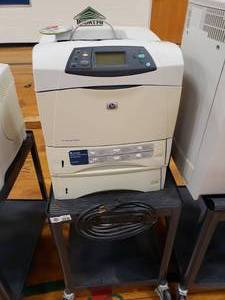 lot 3157 image: HP Laserjet 4250tn on Black Rolling Cart with Extra Paper