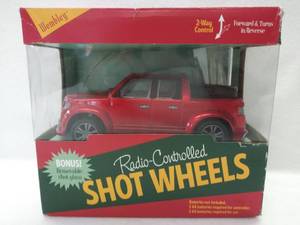 lot 5388 image: NIB Radio Controlled Shot Wheels by Wembley  A Travelling Shot Glass