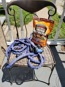 lot 8241 image: Iron Base Chair with Slinky Water Hose and Fire Ant Sheild