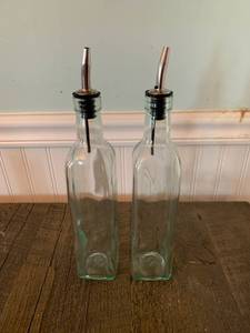 lot 8295 image: Pair of 16 Ounce Olive Oil Pourer Bottles Location Front Room