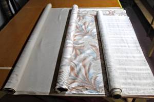 lot 6235 image: This Lot Contains (3) Rolls of Fabric including (1) Vintage Chetley Originals 54, (1) Striped 48 and (1) Solid Linen Looking Double Rolled 59 X 2